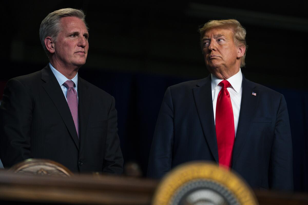Then-President Trump stands with House Minority Leader Kevin McCarthy during an event in Bakersfield on Feb. 19, 2020.