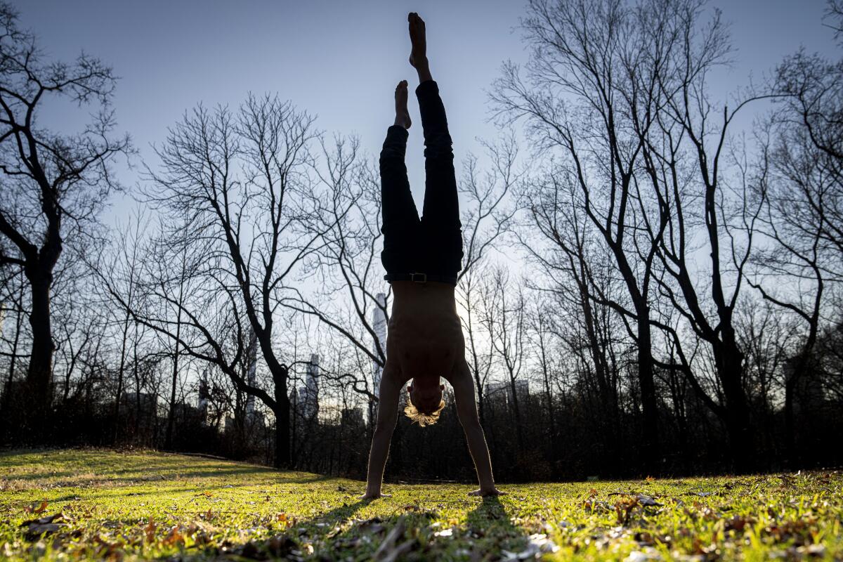 Man does a handstand in New York's Central Park