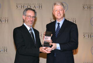 Director Steven Spielberg presents former president Bill Clinton with the Ambassadors Humanity award