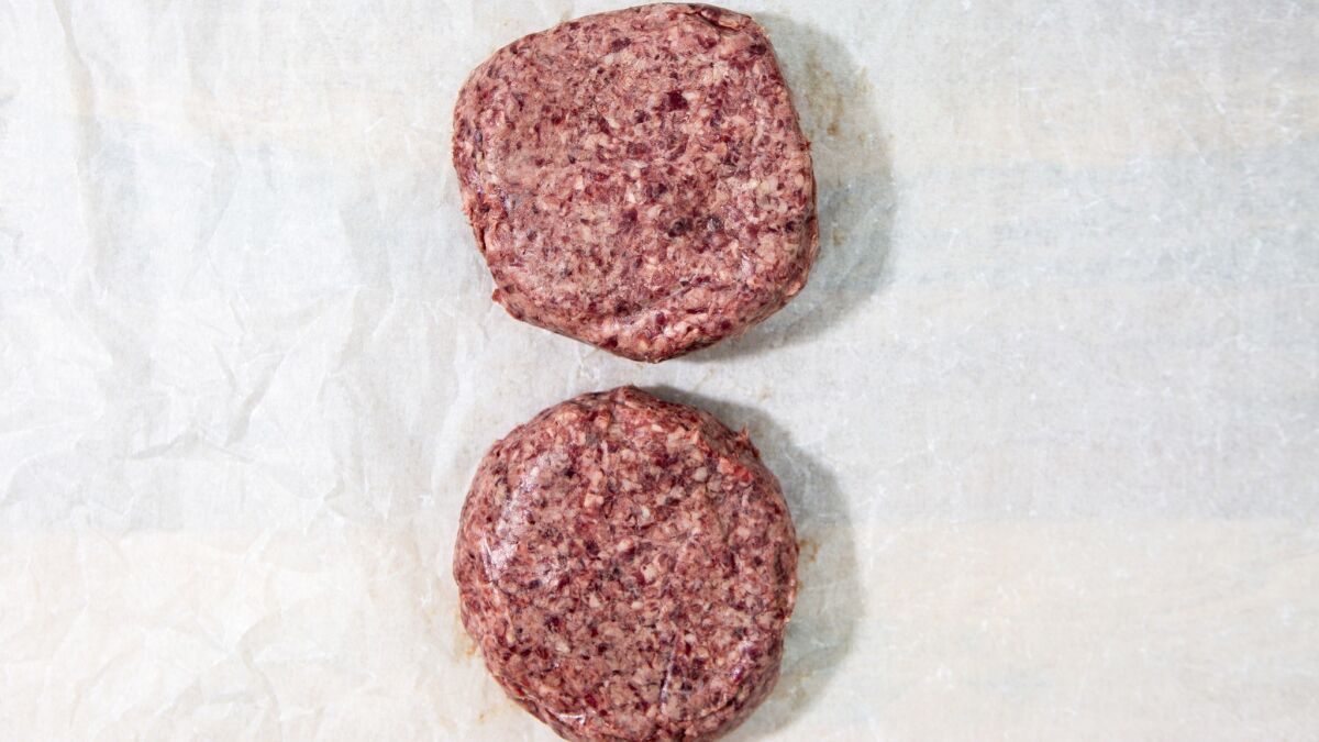 Burger patties made with ground trimmings of dry-aged beef fat have all the flavor of an aged steak and make for an excellent burger, dressed simply with cheese and pepper mayonnaise.