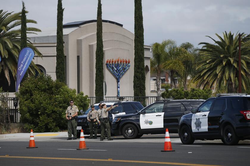 San Diego County Sheriff's deputies stand outside the Chabad of Poway, where a deadly shooting took place the day before on April 28, 2019 in Poway, California. (Photo by K.C. Alfred/The San Diego Union-Tribune)