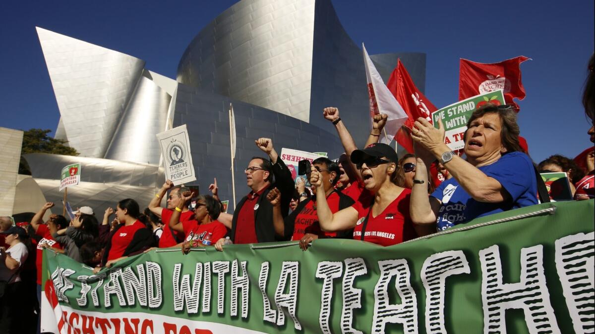 Thousands of teachers and their supporters rally Saturday in downtown Los Angeles.