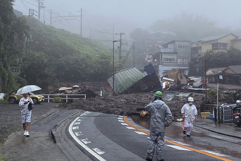 Mud and debris cover a paved roadway