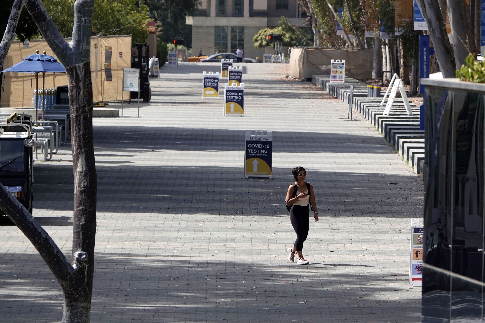 A lone student strolls along Library Walk at UC San Diego