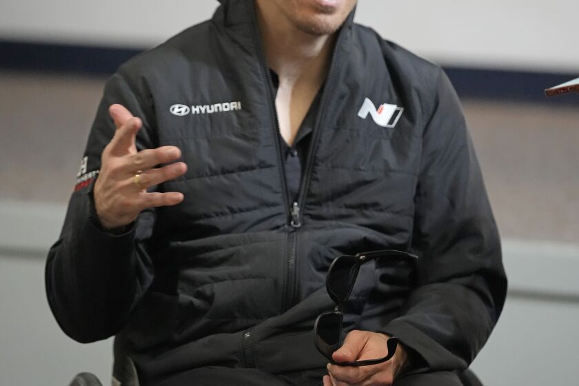 Robert Wickens answers questions during an interview prior to the Rolex 24 hour auto race at Daytona International Speedway, Thursday, Jan. 26, 2023, in Daytona Beach, Fla. Bryan Herta wants to enter Wickens in the Indianapolis 500 as early as 2024. That's even a year longer than preferred because of the work required on the hand control system needed for the paralyzed driver. (AP Photo/John Raoux)