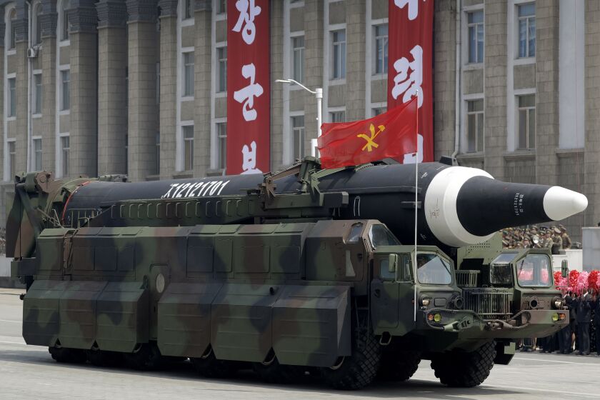 FILE - A missile that analysts believe could be the North Korean Hwasong-12 is paraded across Kim Il Sung Square in Pyongyang on April 15, 2017. North Korea on Tuesday, Oct. 4, 2022 fired an intermediate-range ballistic missile over Japan for the first time in five years. Japanese Defense Minister Yasukazu Hamada said one launched Tuesday could be the same as the Hwasong-12 missile that North has fired four times in the past. (AP Photo/Wong Maye-E, File)