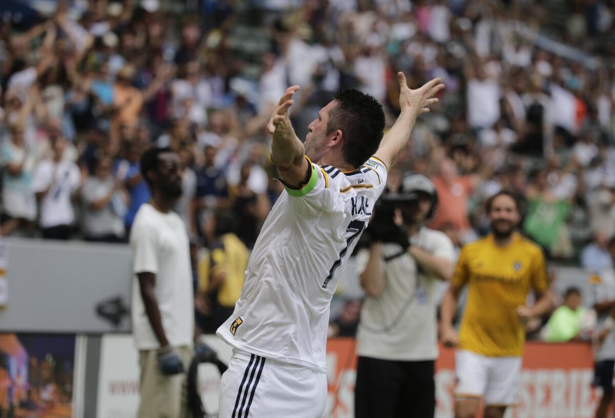 Robbie Keane celebrates after scoring one of his two goals against Portland.