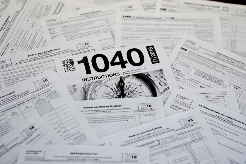 FILE - This photo shows multiple forms printed from the Internal Revenue Service web page in Zelienople, Pa., Feb. 13, 2019. The IRS is overburdened and understaffed, which means even the smallest error could delay the processing of your tax return for months. The biggest mistake is opting for paper filing, which could take longer to process and is often more likely to contain errors. (AP Photo/Keith Srakocic, File)