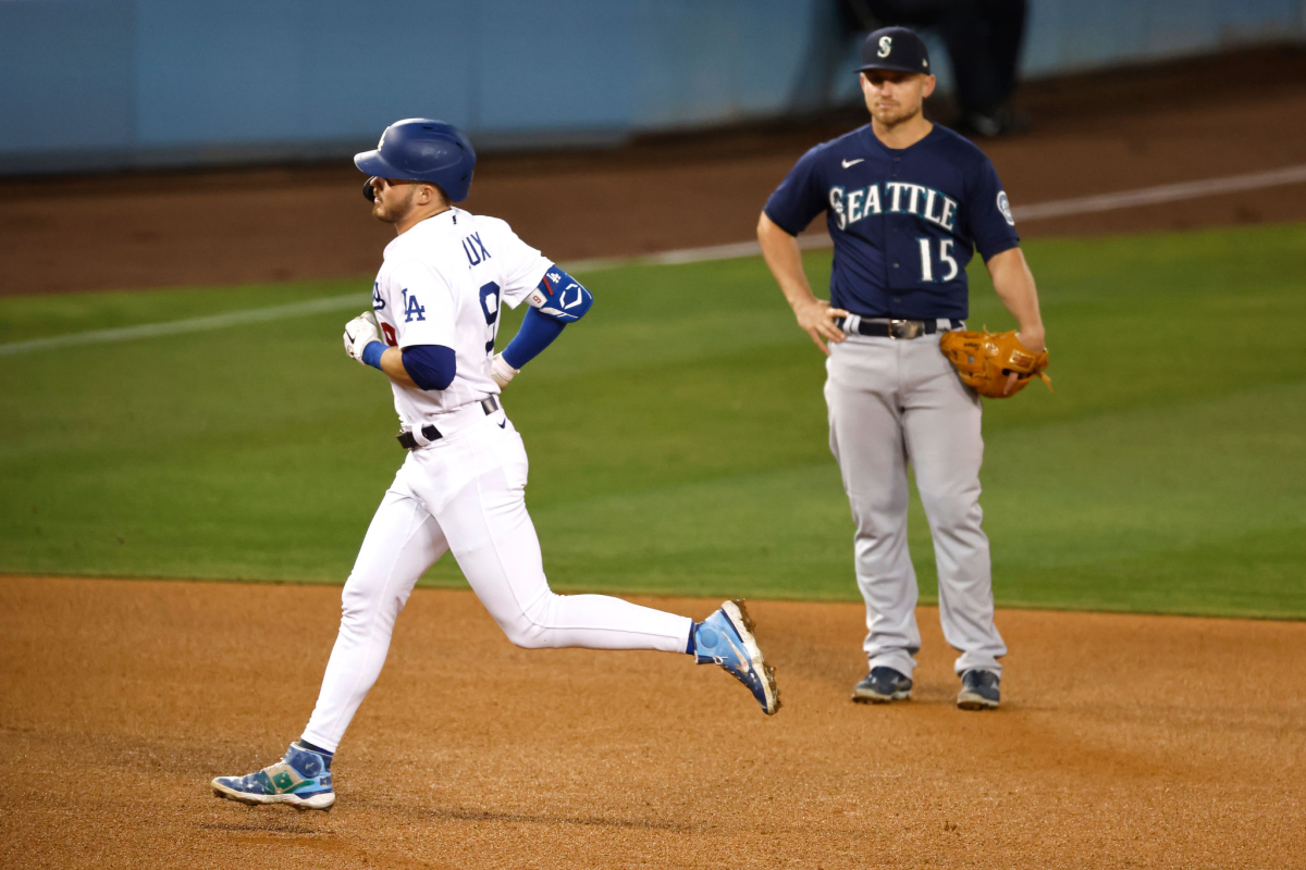 Dodgers second baseman Gavin Lux rounds the bases after hitting a three-run home run.