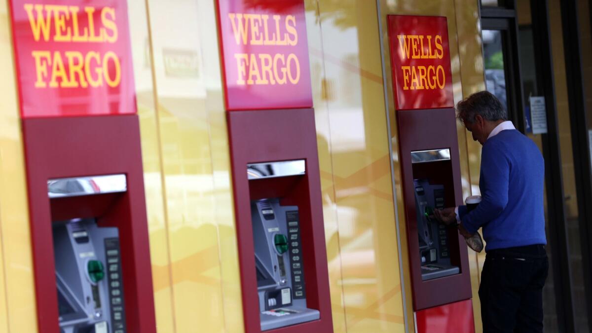 A customer uses a Wells Fargo ATM in San Francisco.