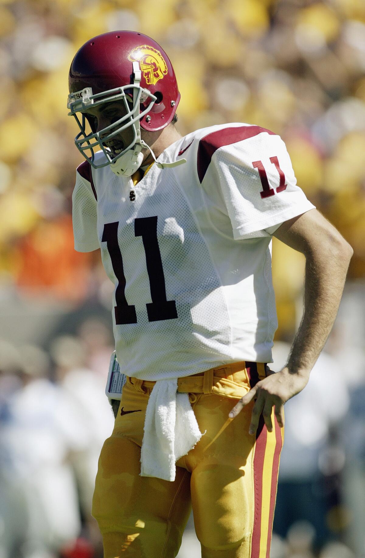 Quarterback Matt Leinart of the USC grimaces as he comes out of the game after injuring himself against the Arizona State.