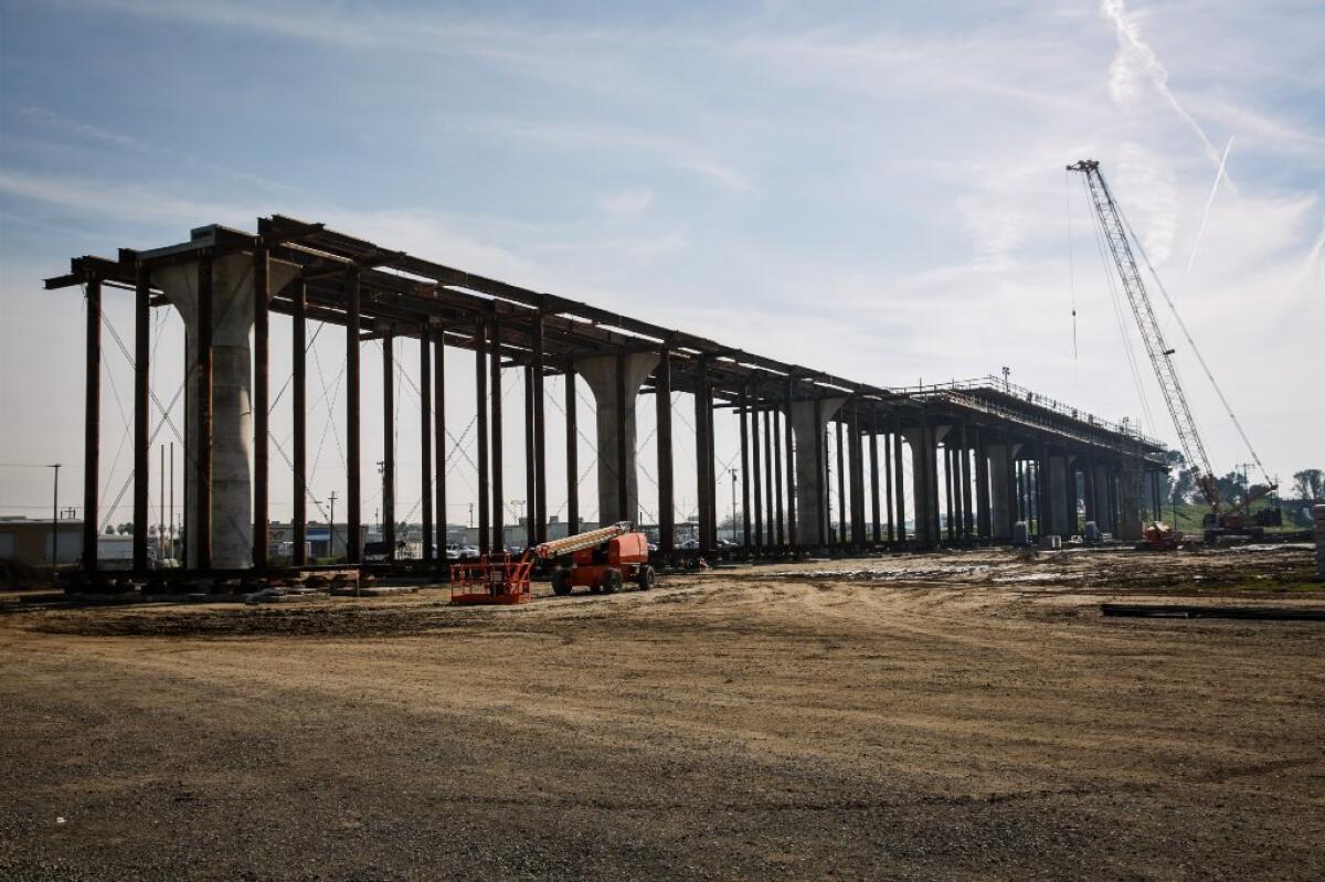 A 3,700-foot viaduct that is being built to extend over State Route 99 in Fresno County for California's high-speed rail line.