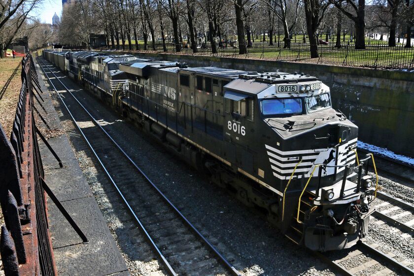 FILE - A Norfolk Southern freight train rolls through downtown Pittsburgh, on March 26, 2018. Norfolk Southern became the first major freight railroad with deals to provide sick time to all of its workers Monday, June 5, 2023 but the other railroads are making progress with nearly 60% of all rail workers securing this basic benefit. All of the major freight railroads have said they're committed to resolving this key issue that nearly led to a strike last year. But most of those railroads are still negotiating with a number of their unions. (AP Photo/Gene J. Puskar, File)