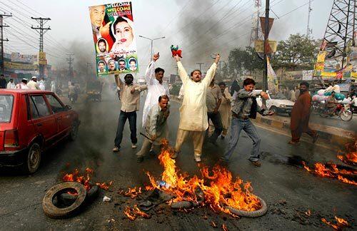 Supporters of former Prime Minister Benazir Bhutto shout slogans against President Pervez Musharraf in Lahore, Pakistan, today.