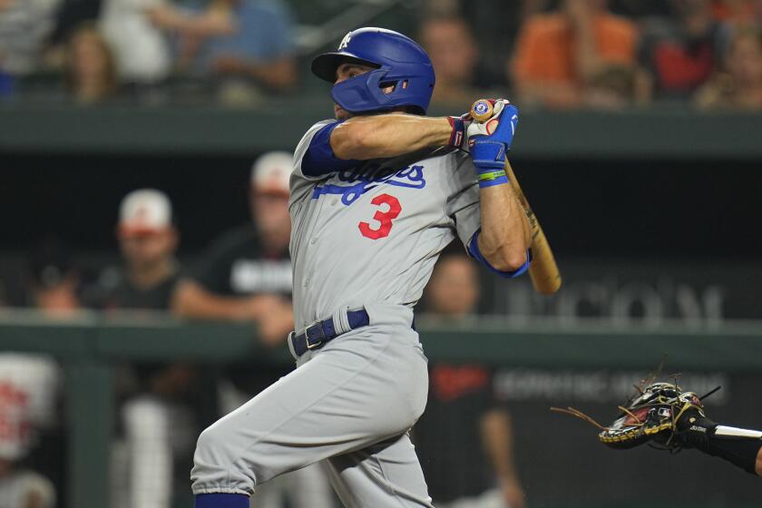 Los Angeles Dodgers' Chris Taylor follows through on a swing against the Baltimore Orioles.