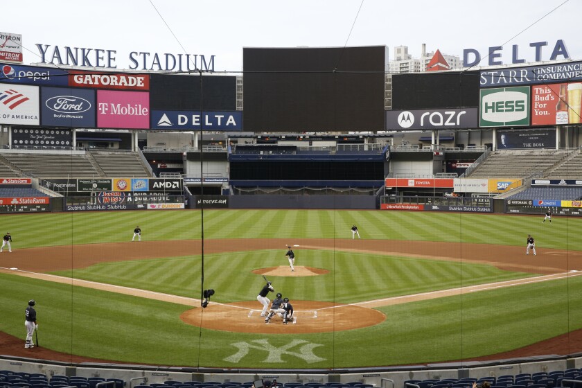 New York Yankees starting pitcher J.A. Happ throws to Miguel Andujar during the first inning of an intrasquad baseball game Monday, July 6, 2020, at Yankee Stadium in New York. (AP Photo/Kathy Willens)