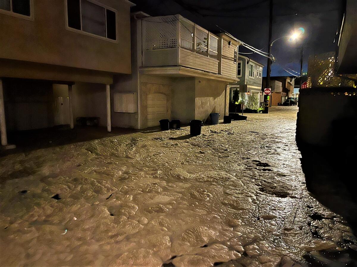 High tide and a coastal swell flooded portions of Seal Beach Wednesday night.