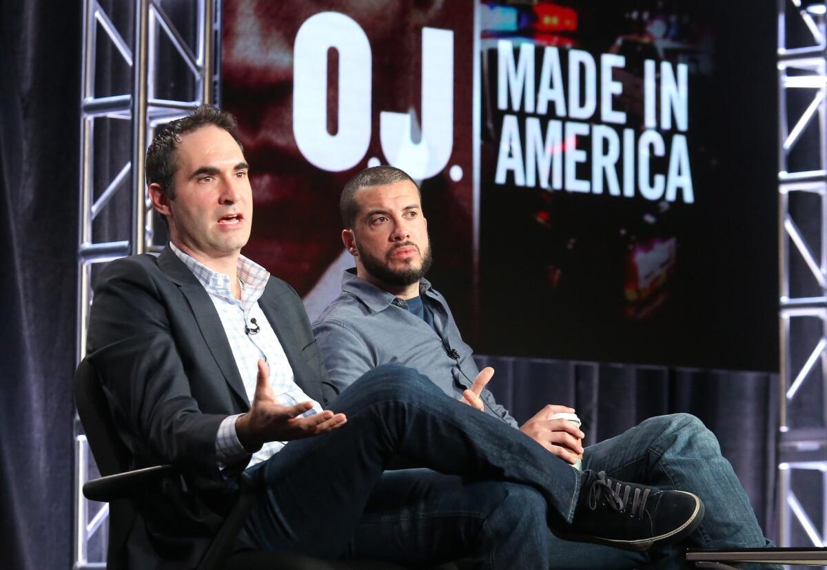 Director Ezra Edelman, right, and ESPN's Connor Schell talk about "O.J.: Made in America" at the TCA press tour in Pasadena on Tuesday.