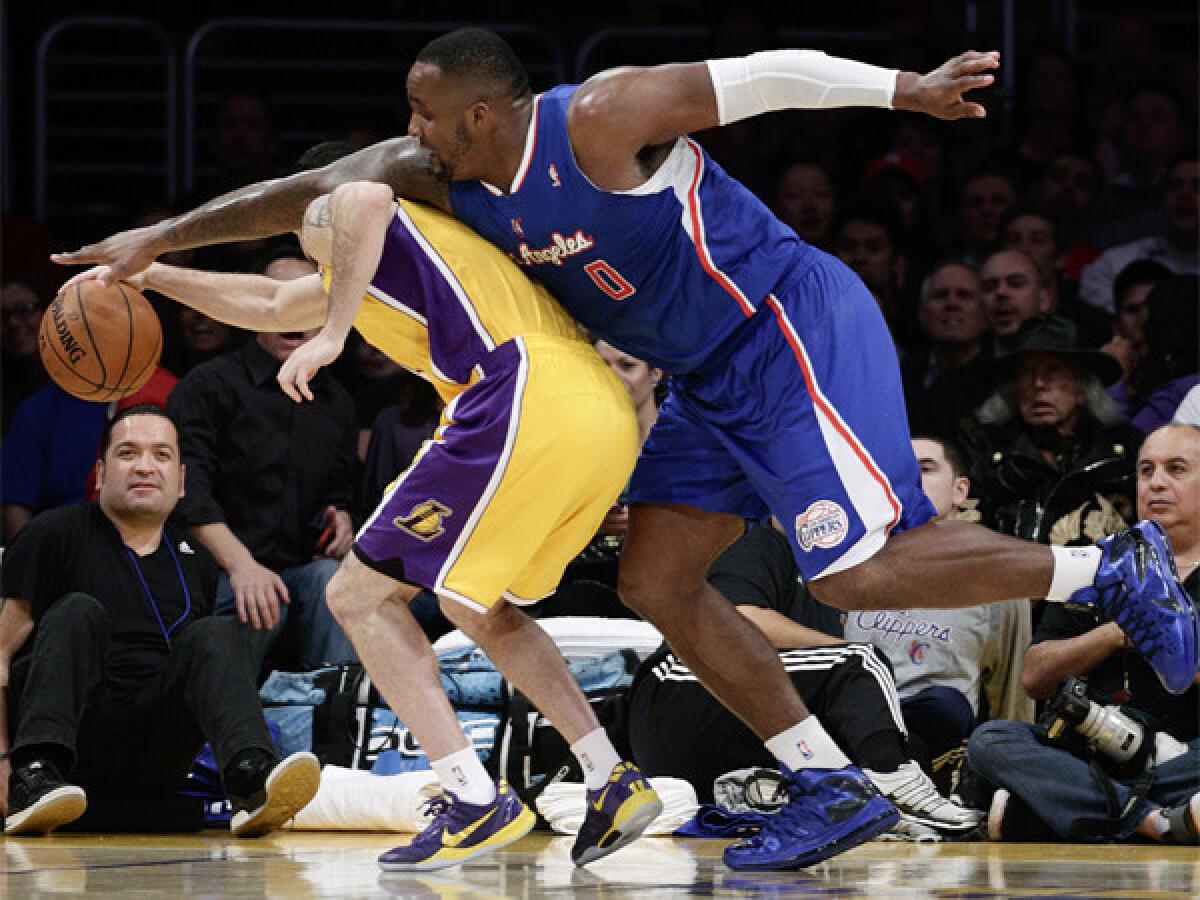 The Clippers' Glen Davis, right, takes on the Lakers' Jordan Farmar at Staples Center on Thursday.