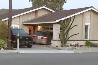 Irvine Police shot a man suspected of crashing a vehicle into a home where another man was found dead in Irvine.