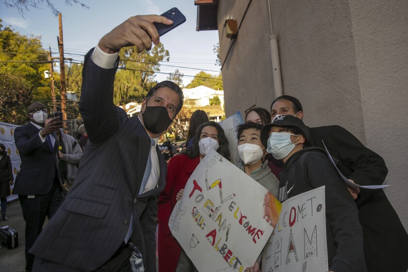 Incoming L.A. schools chief Alberto Carvalho takes selfie with students.  