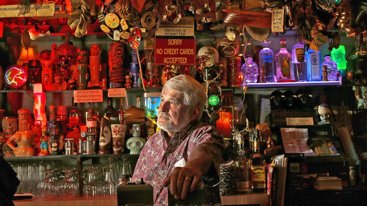 The Los Feliz tiki bar Tiki-Ti is closed only "indefinitely" and will reopen in the future, says owner Mike Buhen. Above, Buhen at the bar in April.