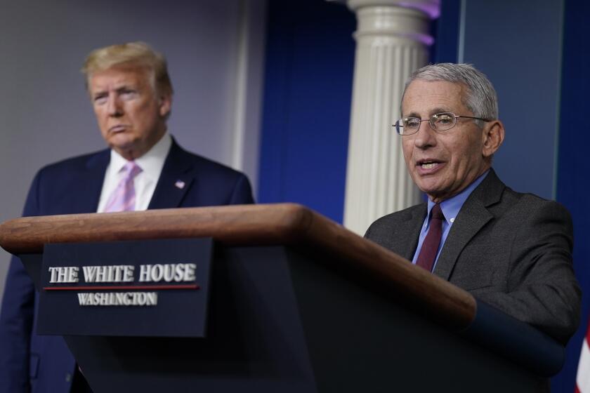 President Donald Trump listens as Director of the National Institute of Allergy and Infectious Diseases Dr. Anthony Fauci speaks during a coronavirus task force briefing at the White House, Friday, April 10, 2020, in Washington. (AP Photo/Evan Vucci)