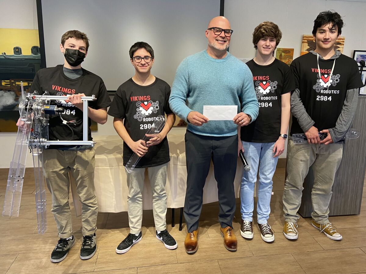 Kiwanis Club of La Jolla President Craig Gagliardi with members of the La Jolla High School robotics team,