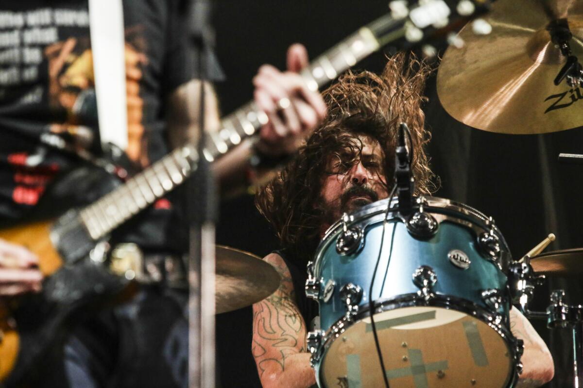 Dave Grohl plays drums.