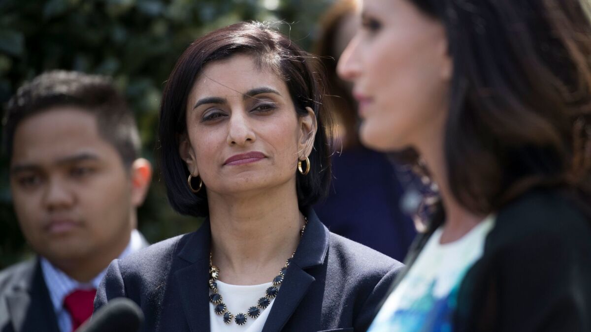 Centers for Medicare and Medicaid Services administrator Seema Verma listens as Penny Nance, the CEO of Concerned Women for America, delivers remarks outside the West Wing of the White House in Washington, D.C. on April 13, 2017.