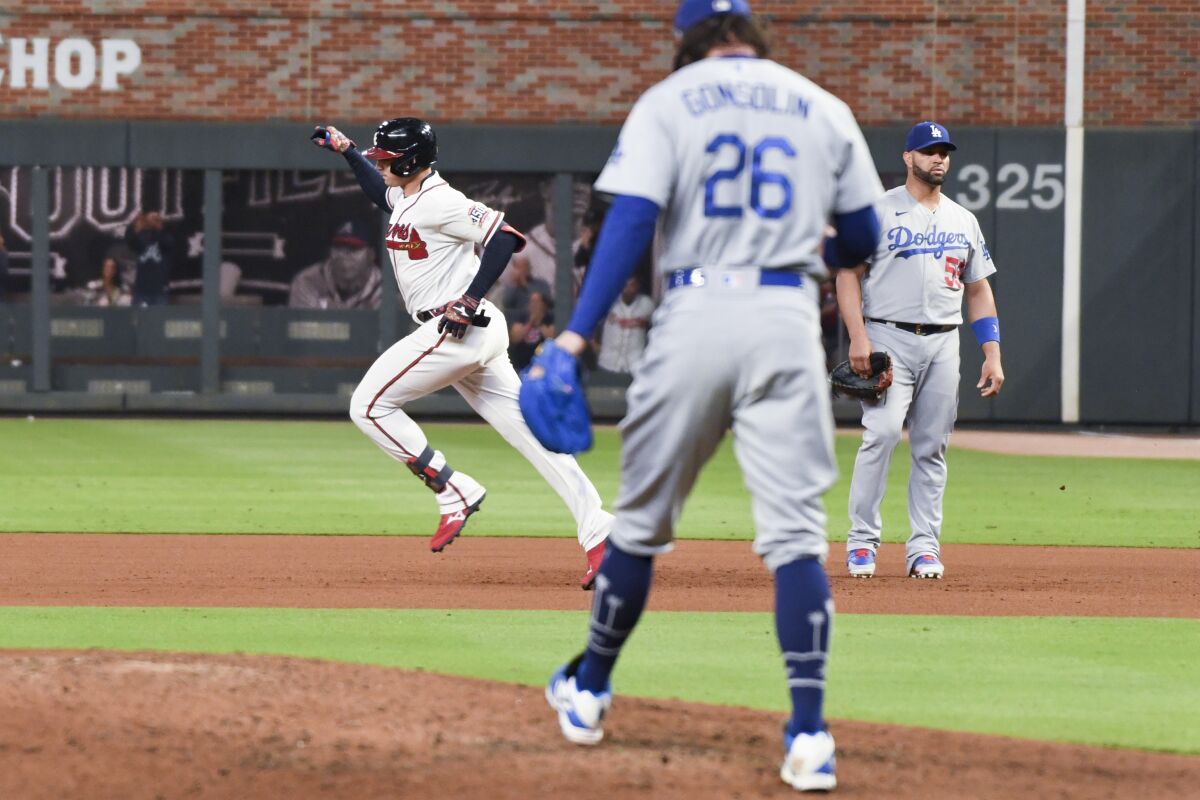 Atlanta's Austin Riley rounds the bases after hitting a solo home run off Dodgers reliever Tony Gonsolin.