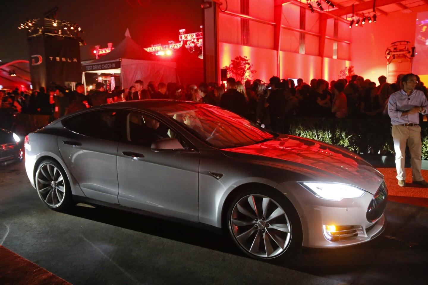Tesla announced a dual motor version of its Model S sedan, the P85D, above, on Thursday night at its Hawthorne Airport facility.