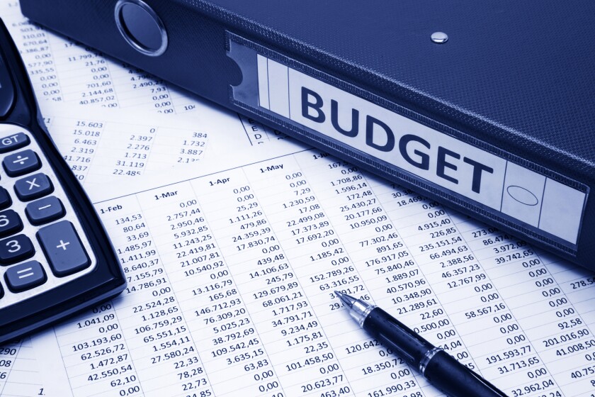 budget binder, pen, calculator