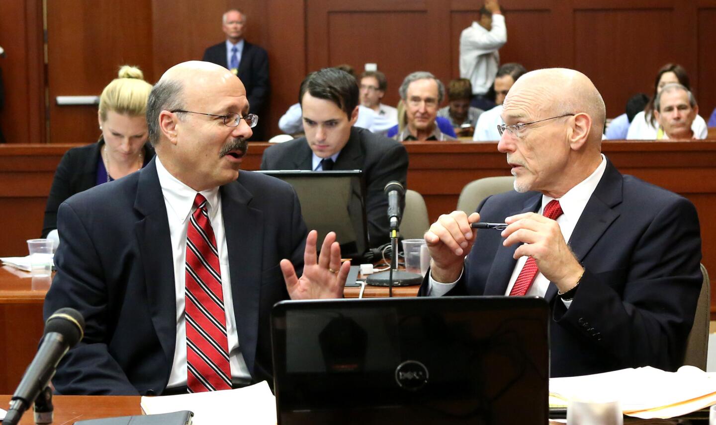 Prosecutor Bernie de la Rionda confers with defense counsel Don West (right) during a recess in the George Zimmerman trial in Seminole circuit court, in Sanford, Fla., Monday, July 8, 2013. Zimmerman is charged with 2nd-degree murder in the fatal shooting of Trayvon Martin, an unarmed teen, in 2012. (Joe Burbank/Orlando Sentinel/POOL) newsgate CCI B583043294Z.1