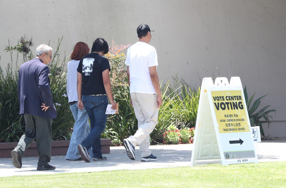 Residents walk in to vote for the Huntington Beach special election at Edison Community Center on Tuesday.