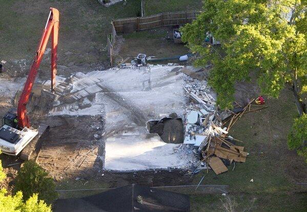 The giant sinkhole at the home of Jeff Bush in Seffner, Fla., has been filled in with dirt.