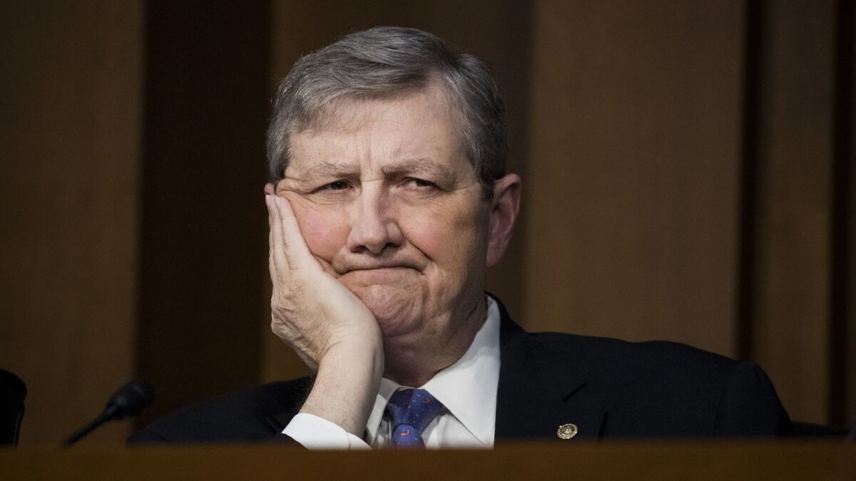 Sen. John Kennedy (R-La.) listens to testimony Wednesday during a Senate Judiciary Committee hearing about firearms. That day he also questioned Matthew Petersen on his judicial experience.