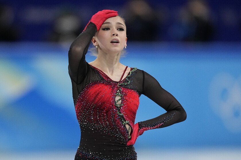 Kamila Valieva, of the Russian Olympic Committee, reacts in the women's team free skate program during the figure skating competition at the 2022 Winter Olympics, Monday, Feb. 7, 2022, in Beijing. Valieva is at the center of the biggest doping story of the Beijing Games after the Russian newspaper RBC reported that the figure skater tested positive for a banned heart medication before the Olympics. Russian athletes are in Beijing competing as the "Russian Olympic Committee" (ROC), after the country was banned because of a massive state-sponsored doping scheme at the Sochi Games in 2014. (AP Photo/David J. Phillip)