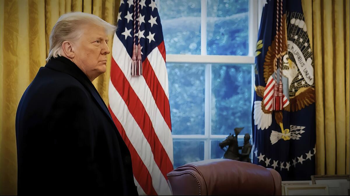 President Trump stands in the Oval Office of the White House.