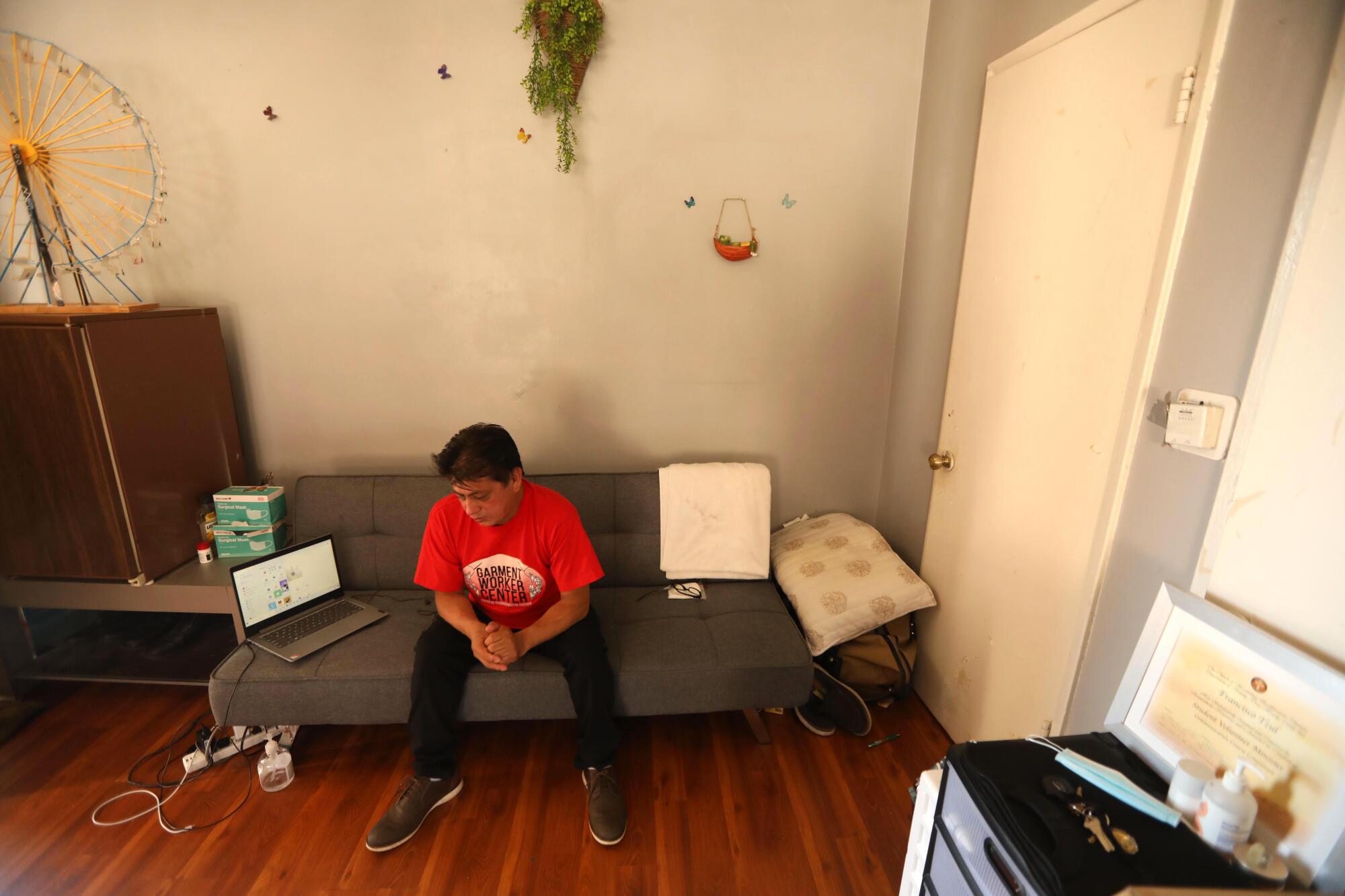 Francisco Tzul sits in the corner of an apartment he rents in North Hollywood.
