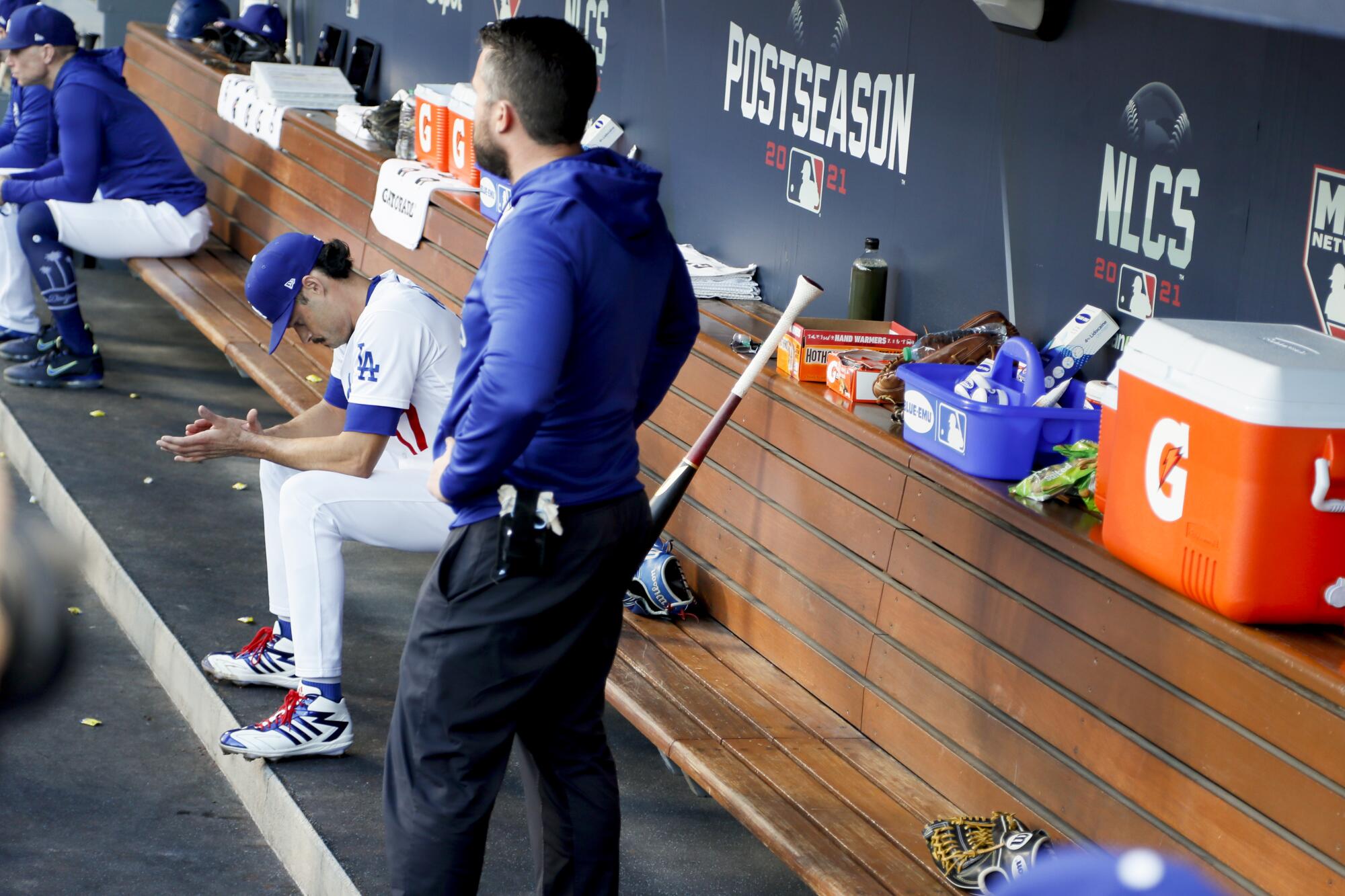  Dodgers starting pitcher Joe Kelly sits in the dugout after being taken out.