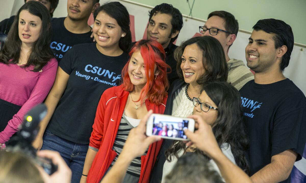 Students pose for a photo with U.S. Senate candidate Kamala Harris after a campaign event at Cal State Northridge on Tuesday.