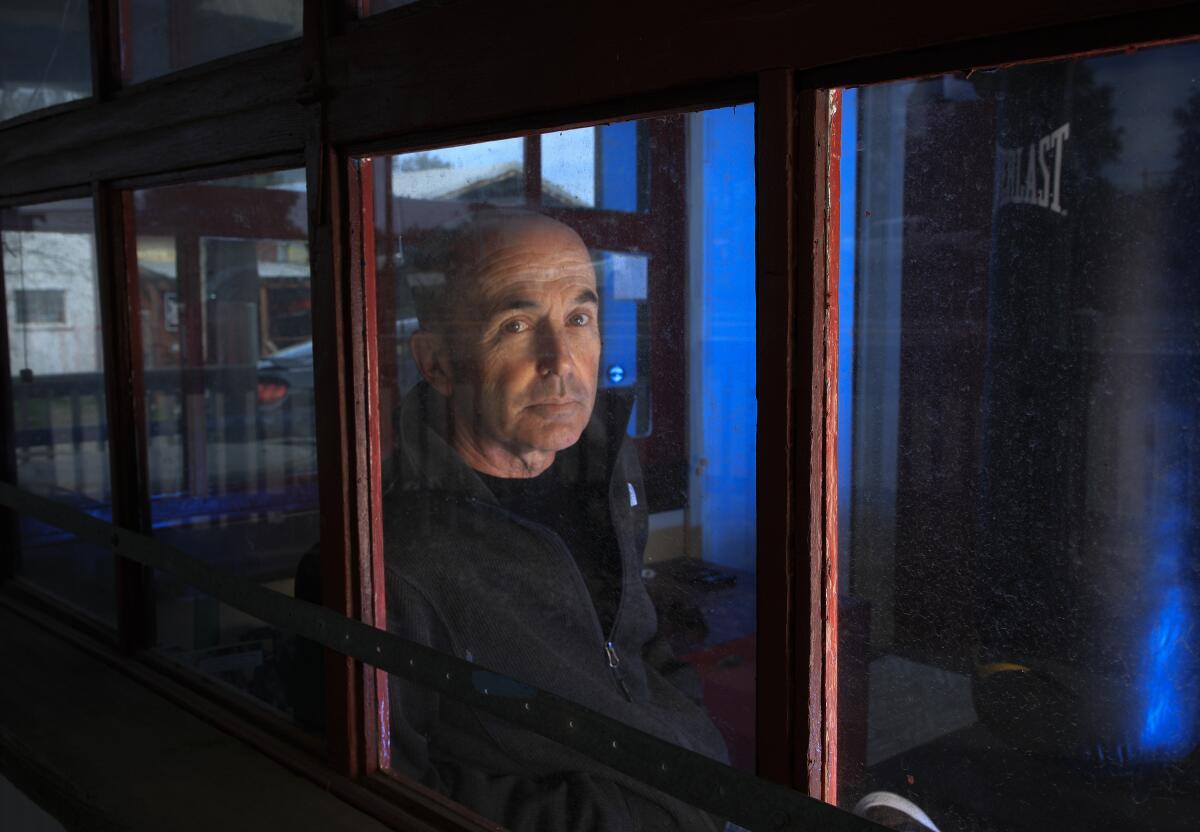  Don Winslow is shown being framed by a window