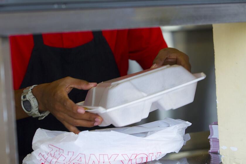 SOLANA BEACH, CA-OCTOBER 14, 2015: | At local taco shop in Solana Beach, Eduardo Garcia packages up a to go order of food in to go polystyrene for a waiting customer. Solana Beach is the first city on the county to ban polystyrene. The ordnance if approved on a routine second reading at a council meeting next Wednesday, would be effective in 30-days, with a six-month grace period for restaurants to use up their existing supplies of polystyrene products or to apply for a hardship exemption. | (Nelvin C. Cepeda / San Diego Union-Tribune)