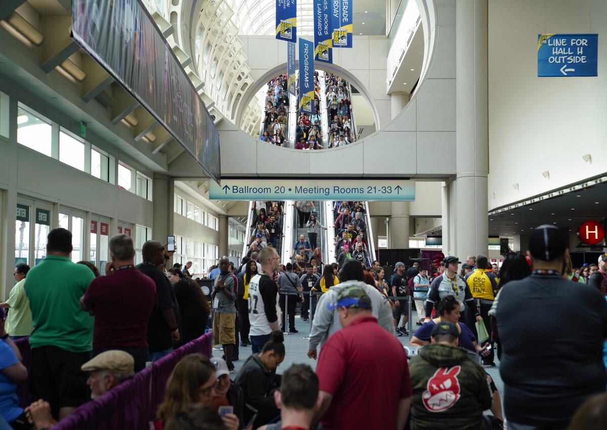 Fans on Thursday July 18, 2019 ride a pack escalator down towards the main convention floor for Comic-Con.