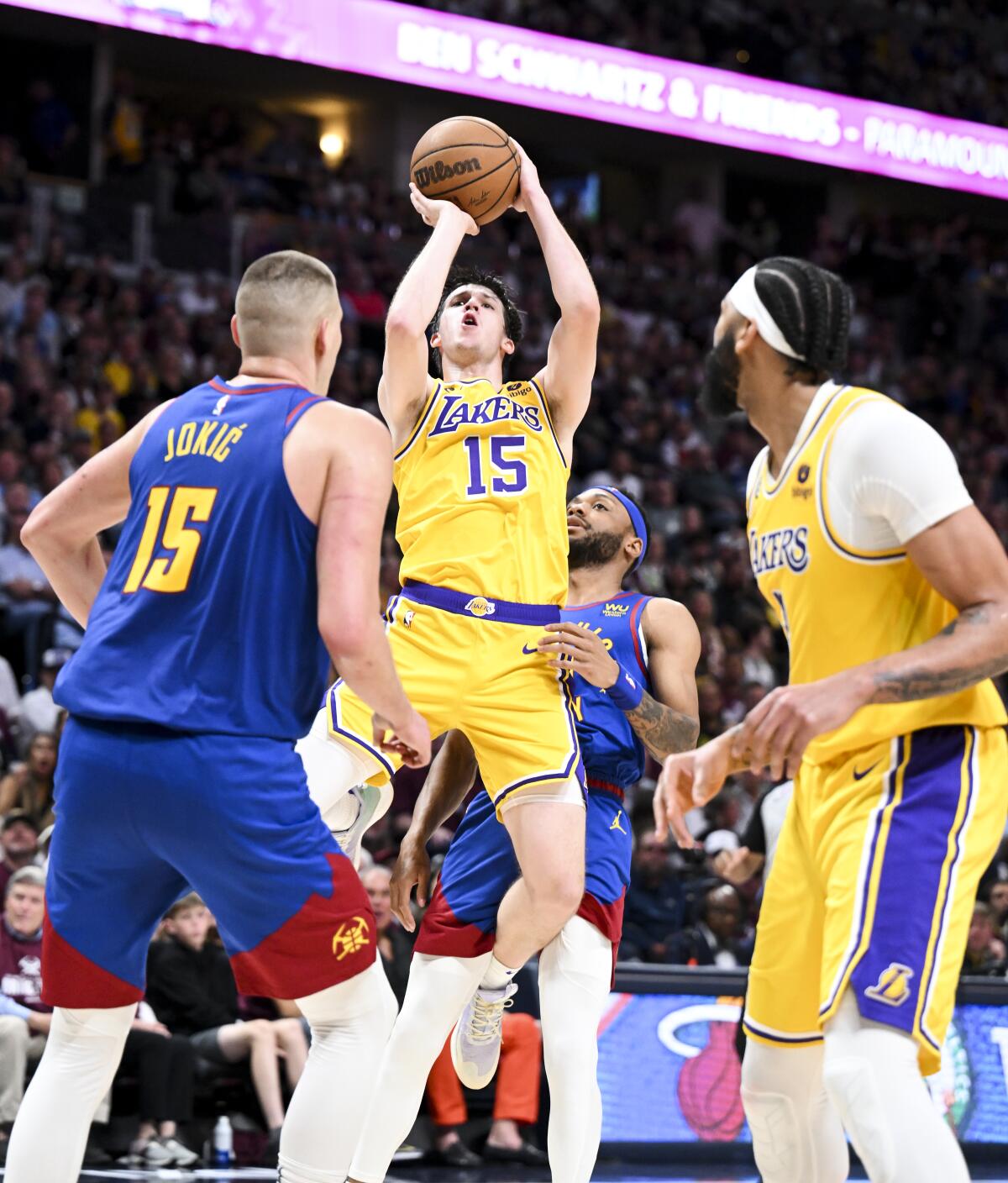 Lakers guard Austin Reaves, center, pulls up for a short-range jump shot during the second half of Game 1.