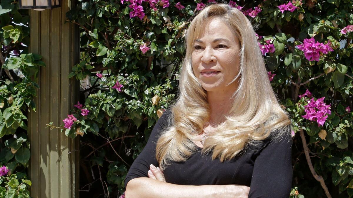 Sherri Simpson is seeking to put on hold President Trump's $25-million settlement of a class-action lawsuit that alleged fraud at his now-defunct Trump University. She wants a full refund plus interest and an apology.