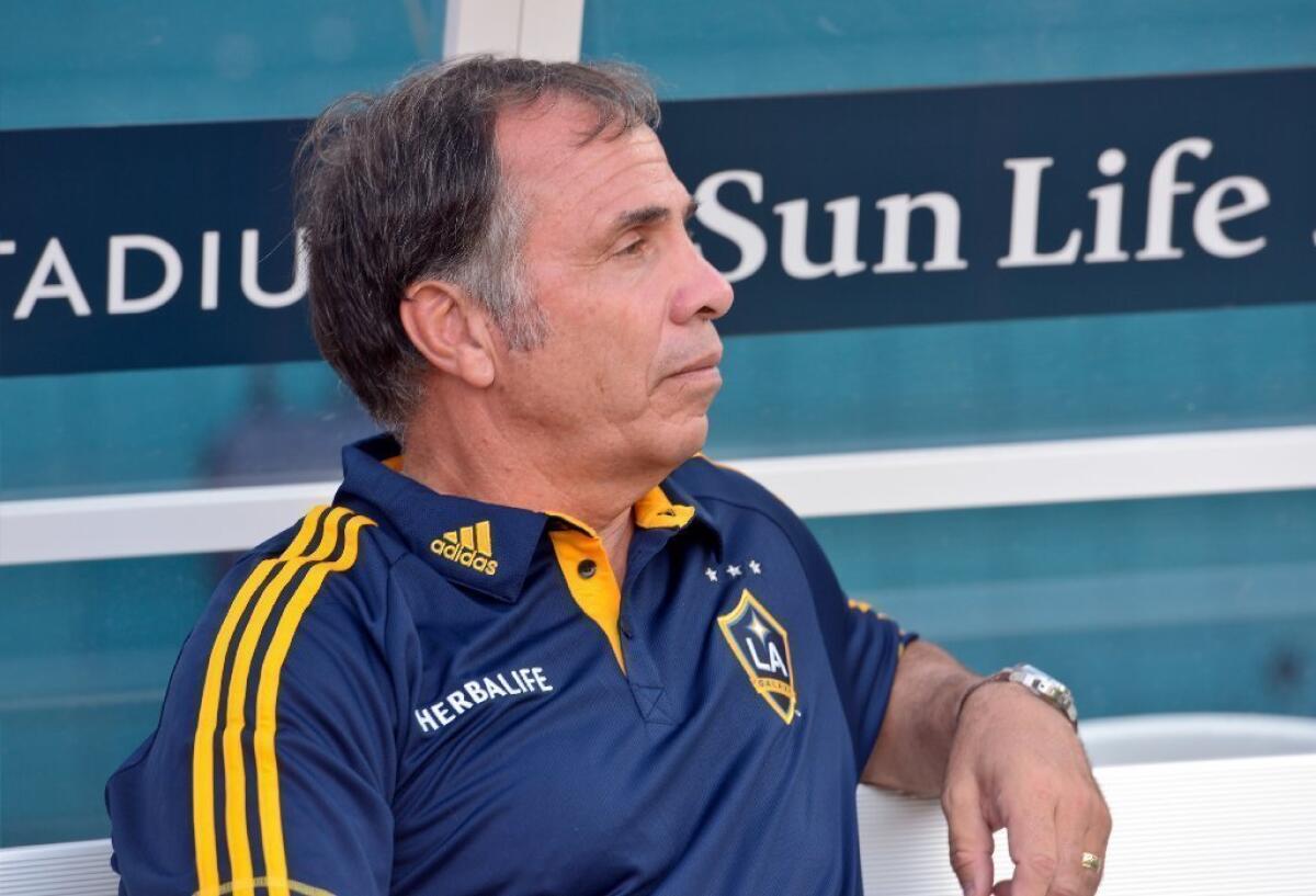 Bruce Arena has a record of 82-46-44 during his tenure with the Galaxy.