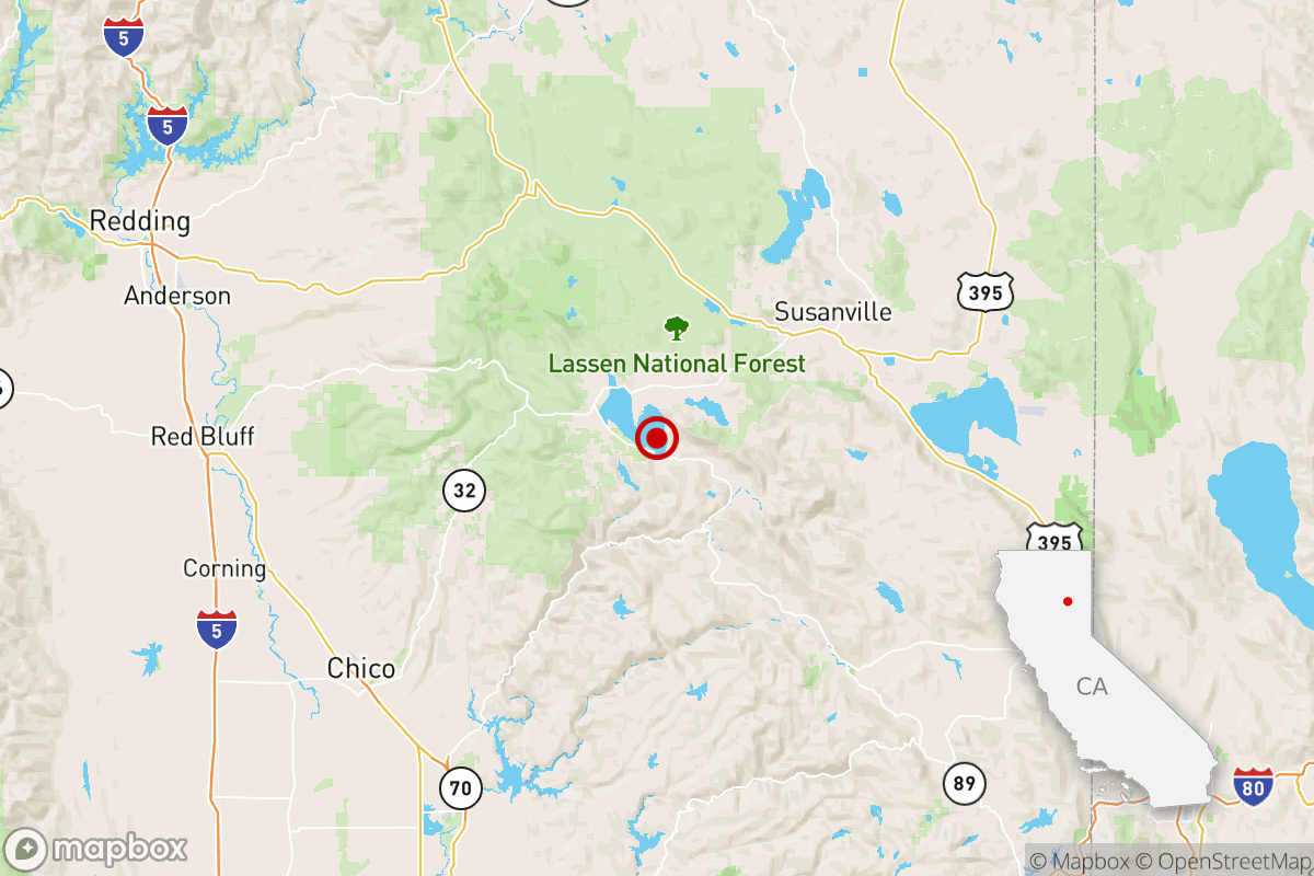 A map with a small red dot and circle.
