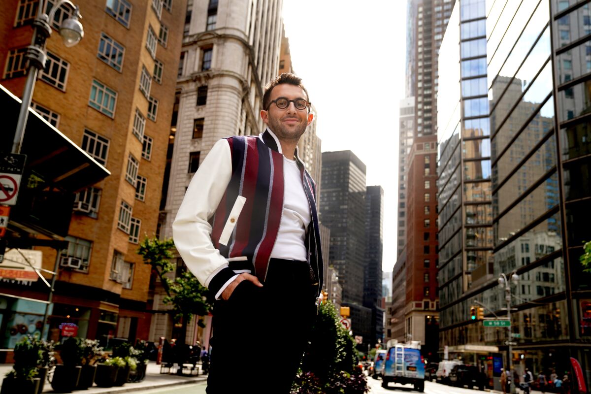 Andrew Gelwicks stands on a street in New York City.